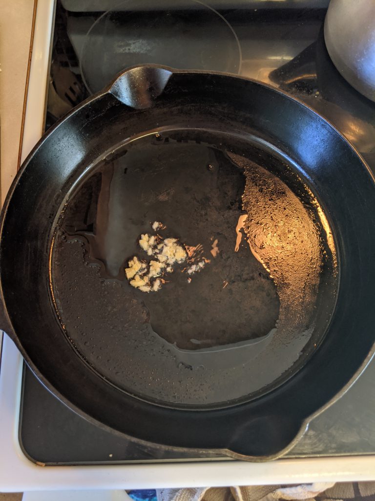 ginger and garlic in a cast iron pan