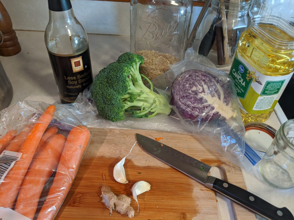 stir fry ingredients: garlic, ginger, cooking oil, veggies, soy sauce