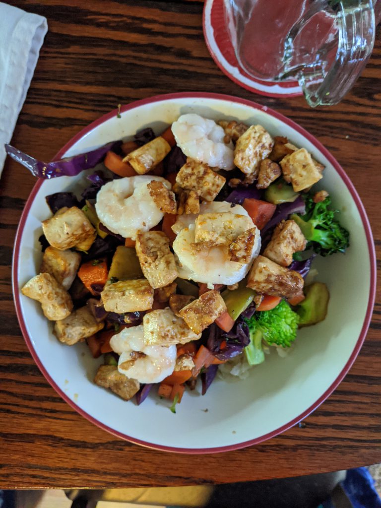 bowl of stir fry with tofu, shrimp and veggies