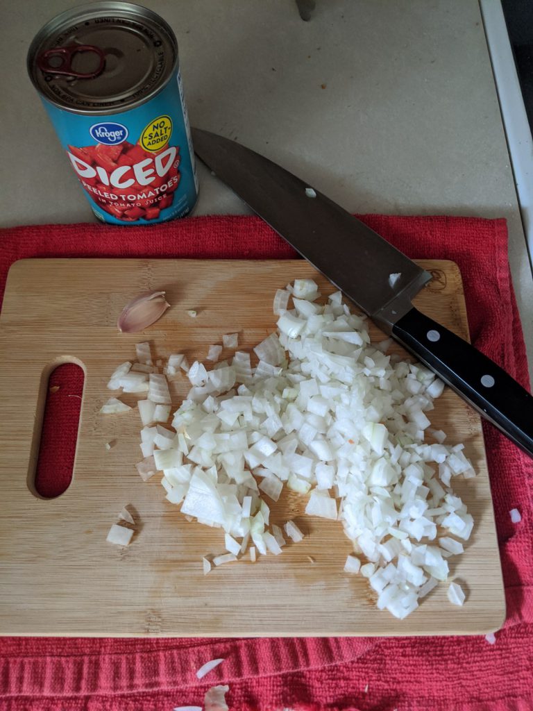 can of tomatoes, chopped onions and garlic