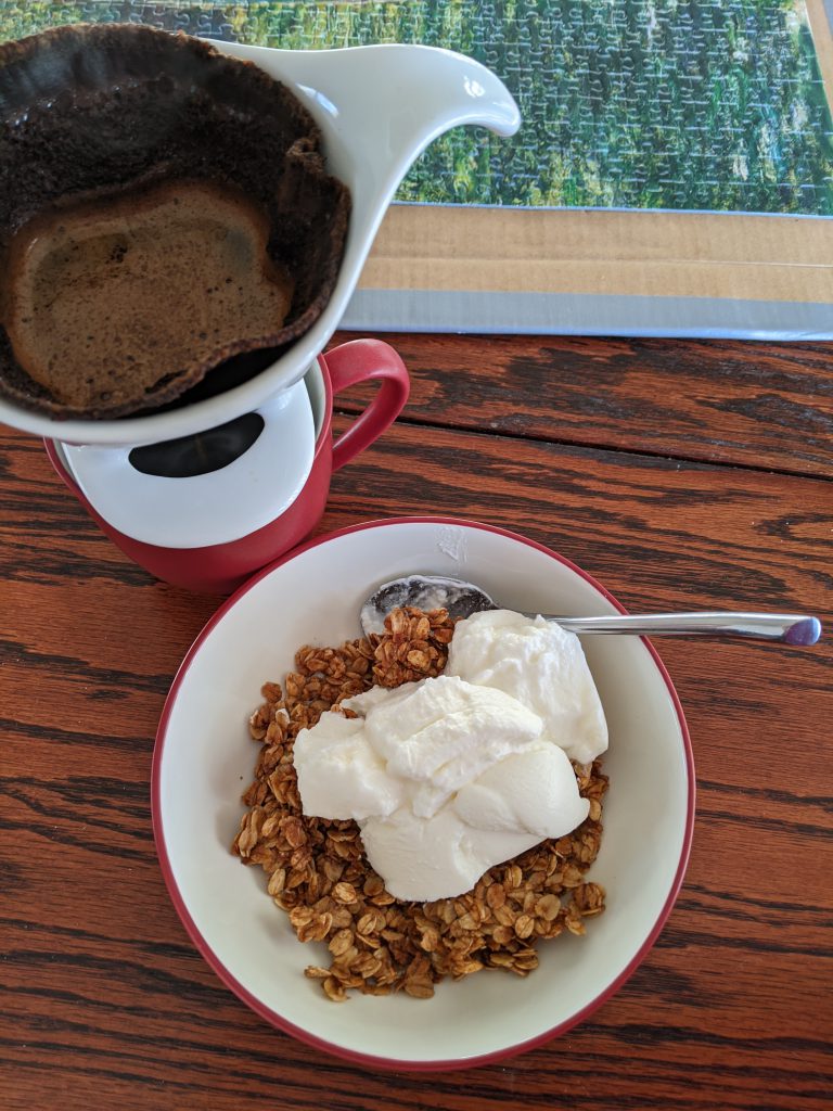 brewing coffee and a bowl of granola